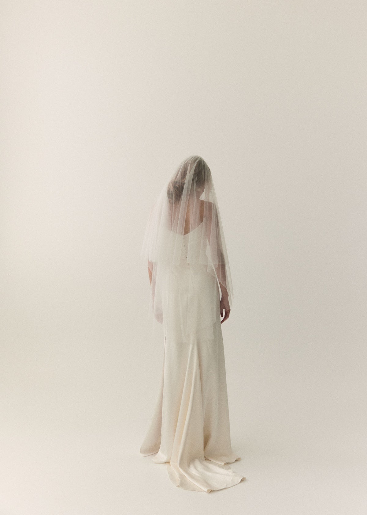 The Prea James Emiline wedding gown, styled with a 2 Tier tulle bridal veil, fingertip length.
