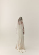The Prea James Emiline wedding gown, styled with a 2 Tier tulle bridal veil, fingertip length.